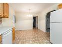 Bright eat-in kitchen featuring a door to the outside and seamless access to other rooms at 1000 Strobus Ct, Wendell, NC 27591