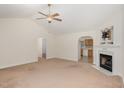 Inviting living room featuring a decorative fireplace and seamless access to the adjacent kitchen area at 1000 Strobus Ct, Wendell, NC 27591