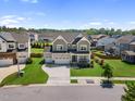 Beautiful two-story home with a two car garage, landscaped front yard, and inviting curb appeal at 109 Obsidian Dr, Holly Springs, NC 27540