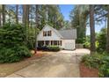 Inviting curb appeal with a well-manicured lawn and a charming white cottage-style home at 14 Donnibrook, Fuquay Varina, NC 27526