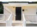 Close-up of the front door showcasing its black color, the house number, and tidy white railings at 2312 Shannon St, Raleigh, NC 27610
