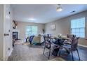 Open-concept living room featuring hardwood floors, fireplace, and abundant natural light at 2459 Bay Harbor Dr, Raleigh, NC 27604