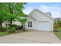 Charming single-story home featuring light siding, a one car garage, and a well-maintained front yard with manicured shrubs at 3108 Forrestal Dr, Durham, NC 27703