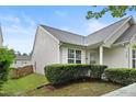 Charming home with light siding, manicured front yard hedges, and close proximity to a fence and neighboring property at 3108 Forrestal Dr, Durham, NC 27703