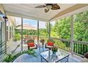Relaxing screened-in porch with comfortable seating and scenic views of the surrounding nature at 372 Farnleigh Dr, Chapel Hill, NC 27517