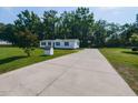 Home with long driveway situated on large lot at 4125 Brushy Ridge Dr, Holly Springs, NC 27540