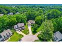 An aerial view of a home nestled in a lush, green neighborhood at 509 Fish Pond Ct, Rolesville, NC 27571