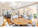 Open-concept living space with hardwood floors, neutral tones, and ample natural light at 509 Fish Pond Ct, Rolesville, NC 27571