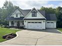 Charming two-story home with a well-manicured lawn and an attached two-car garage at 525 Allesandra Dr, Clayton, NC 27527