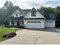 Charming two-story home with a well-manicured lawn and an attached two-car garage at 525 Allesandra Dr, Clayton, NC 27527