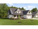 New construction featuring beautiful landscaping, a large yard and inviting entrance at 525 Allesandra Dr, Clayton, NC 27527