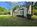 Single-Gathering home with a landscaped front yard and beautiful bay window at 5401 Lower Creek Ct, Apex, NC 27539
