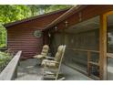 View of the covered porch with rocking chairs at 5604 Hideaway Dr, Chapel Hill, NC 27516