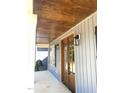 Side entryway with wood ceiling and double doors at 60 Stream View Way, Spring Hope, NC 27882