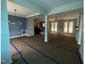 Spacious living room featuring open floor plan, abundant natural light and contemporary light fixture at 60 Stream View Way, Spring Hope, NC 27882