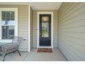 Welcoming front entrance with a glass-paneled door and a cozy 'hello' doormat at 672 Millers Mark Ave, Wake Forest, NC 27587
