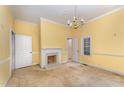 Spacious living room featuring a fireplace and natural light at 6720 Dwight Rowland Rd, Willow Springs, NC 27592