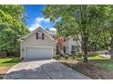 Attractive two-story home with a spacious driveway and a beautifully landscaped front yard at 8504 Delavan Cir, Raleigh, NC 27613