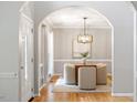 Elegant dining room with hardwood floors, decorative chandelier, and stylish decor at 9400 Leslieshire Dr, Raleigh, NC 27615