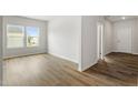 Bright living room boasts beautiful floors and lots of natural light from the large windows at 95 Cordoba Dr, Franklinton, NC 27525