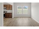 Bright living room boasts beautiful floors and lots of natural light from the large windows at 95 Cordoba Dr, Franklinton, NC 27525