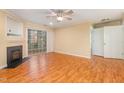 Spacious living area with a fireplace, neutral paint and access to additional rooms at 1002 Kingswood Dr # A, Chapel Hill, NC 27517