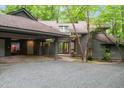 Beautiful home with a covered entrance, attached carport, and mature landscaping at 106 Mill Rock Ct, Carrboro, NC 27510