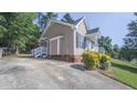 This home features convenient parking and an attractive, well-maintained side yard with verdant landscaping at 133 Parkhaven Ln, Garner, NC 27529