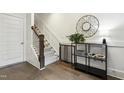 Inviting entryway showcasing hardwood floors, elegant decor, and staircase at 1602 Bowery Dr, Raleigh, NC 27607