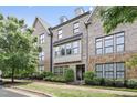 Stunning brick townhouse with manicured landscaping and a welcoming facade at 1602 Bowery Dr, Raleigh, NC 27607