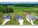 Aerial view of home showing large yard, driveway, and neighboring houses in a peaceful community at 173 Vinson Park Dr, Archer Lodge, NC 27527