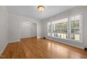 Bright living room with hardwood floors and a large window view at 1837 Garrett House Trl, Burlington, NC 27215