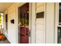Close-up of the front door showcasing historic plaque and charming architectural details at 203 Brick St, Wake Forest, NC 27587