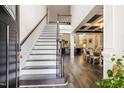 Grand entryway with staircase, hardwood floors, and views into the living and dining spaces at 211 Education Dr, Spring Lake, NC 28390