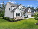 Beautiful home showcasing manicured lawn, brick details, and well-maintained landscaping at 211 Education Dr, Spring Lake, NC 28390