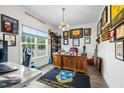 Well-lit office space with a large window, wooden desk, and ample display shelving at 211 Education Dr, Spring Lake, NC 28390