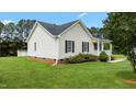 Well-maintained home featuring a neat lawn, charming porch, and vinyl siding at 3803 Ridgewood Dr, Franklinton, NC 27525