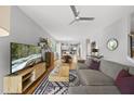 Open-concept living room featuring hardwood floors, neutral color palette, and natural light throughout the space at 409 E Lee St, Raleigh, NC 27601