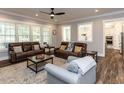 Spacious living room with two leather sofas and a decorative rug, perfect for entertaining at 4104 Bankshire Ln, Raleigh, NC 27603