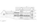 The rear of the home features a modern two-story design with multiple decks, and large windowed doors at 498 Brook Green Ln # 25, Pittsboro, NC 27312
