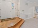 Inviting foyer with wood floors on the steps and neutral-colored carpet at 5 Wembley Ct, Durham, NC 27705