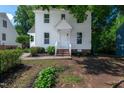 Charming two-story home featuring a classic white exterior and welcoming front porch at 5236 Turf Grass Ct, Raleigh, NC 27610