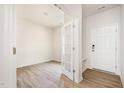 Bright entryway features wood-look floors, a convenient bench, and an open doorway to another room at 112 Hays St, Oxford, NC 27565