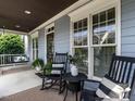 Inviting front porch featuring rocking chairs, a porch swing and stylish decor at 1206 Chalk Maple Dr, Cary, NC 27519