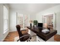 Comfortable office with a view of a staircase through glass french doors at 1401 Brewer Jackson Ct, Wake Forest, NC 27587