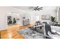 Sunlit living room with stylish decor, hardwood floors, and an open layout at 1514 Lawrence Rd, Creedmoor, NC 27522