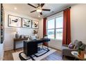 Bright home office featuring modern decor, a ceiling fan, and bright window at 18 Relaxing Way, Pittsboro, NC 27312