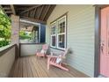 Inviting front porch with comfortable seating, perfect for relaxing and enjoying the neighborhood views at 2070 Great Ridge Pkwy, Chapel Hill, NC 27516