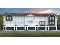 Row of charming two-story townhomes with black garage doors and a well-maintained lawn at 2152 Grouse Ski Cir, Apex, NC 27523