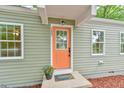 Close-up of the front door with modern updates, new paint, and a welcoming entrance at 2602 Francis St, Durham, NC 27707